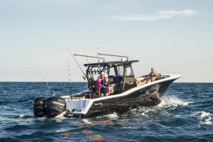 Tidewater boats for sale featuring an offshore center console with twin outboards and family-friendly seating