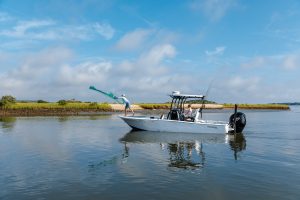 Tidewater boats for sale running inshore waters with anglers casting from a Tidewater Carolina Bay fishing boat