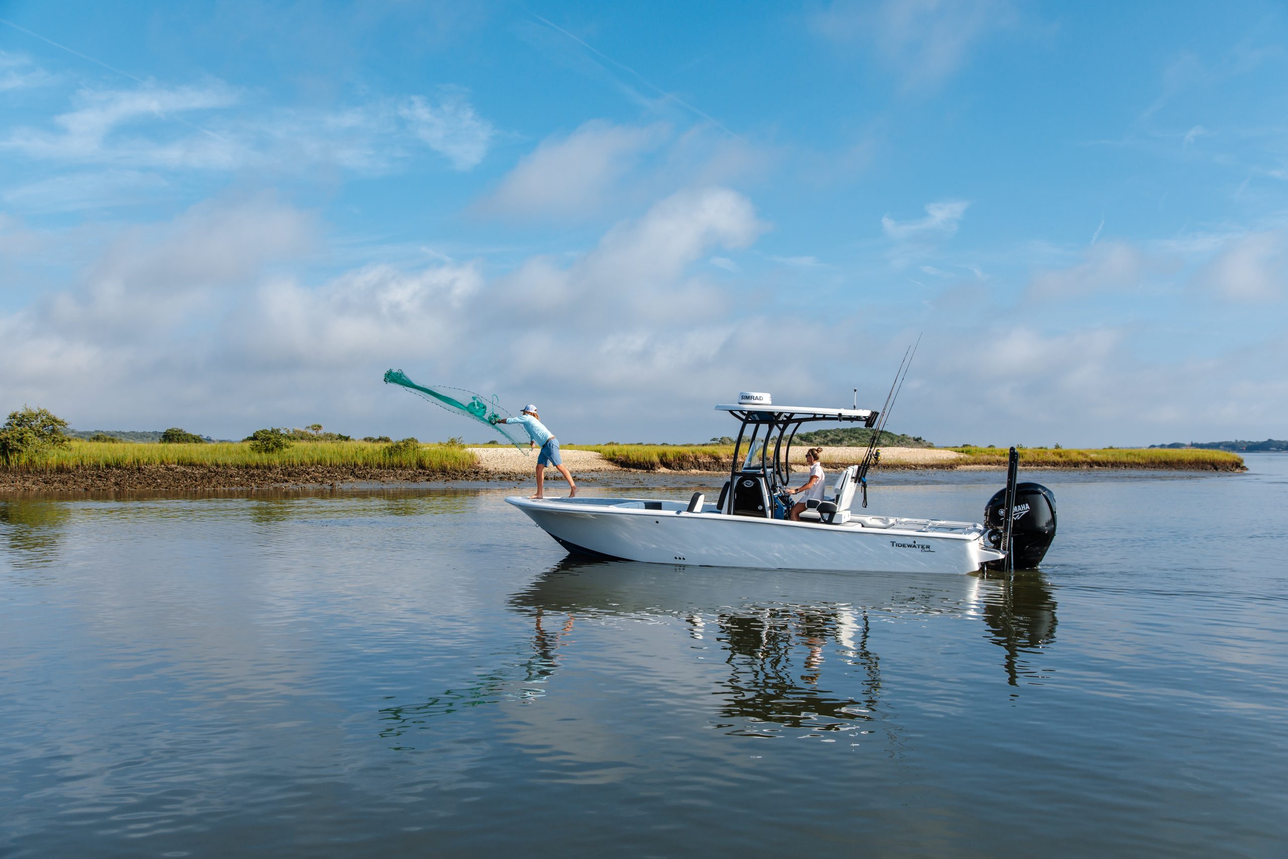 Tidewater boats for sale running inshore waters with anglers casting from a Tidewater Carolina Bay fishing boat