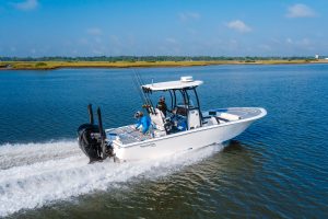 Tidewater center console boat running offshore with dual outboards